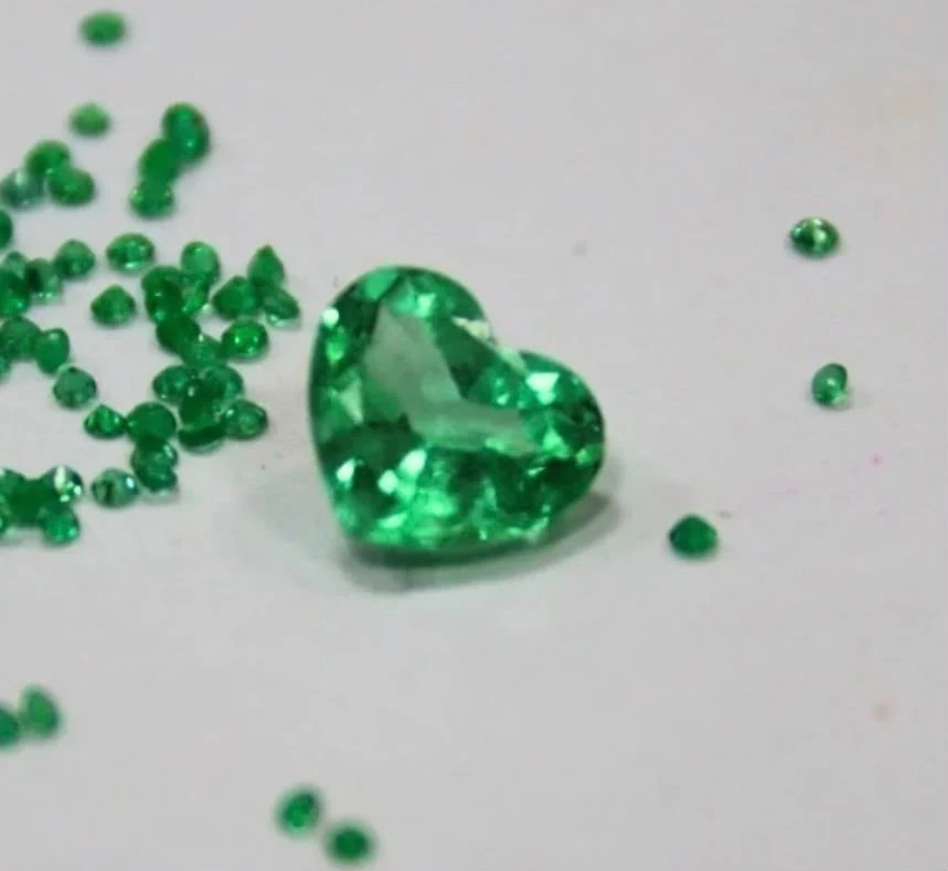 Original photograph of a heart-shaped green gemstone supplied by Nocturne